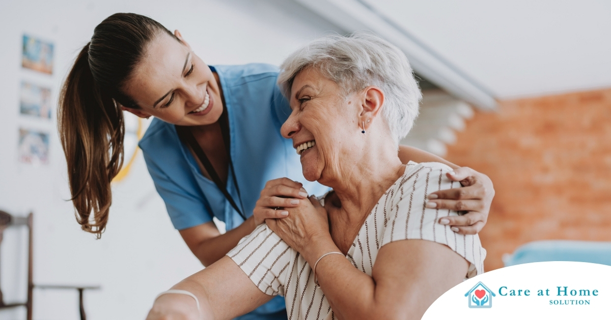 A female caregiver helping an older woman with stroke recovery at home A female caregiver helping an older woman with stroke recovery at home.